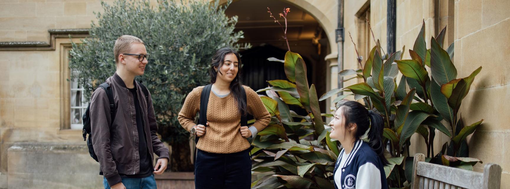 Three students talking