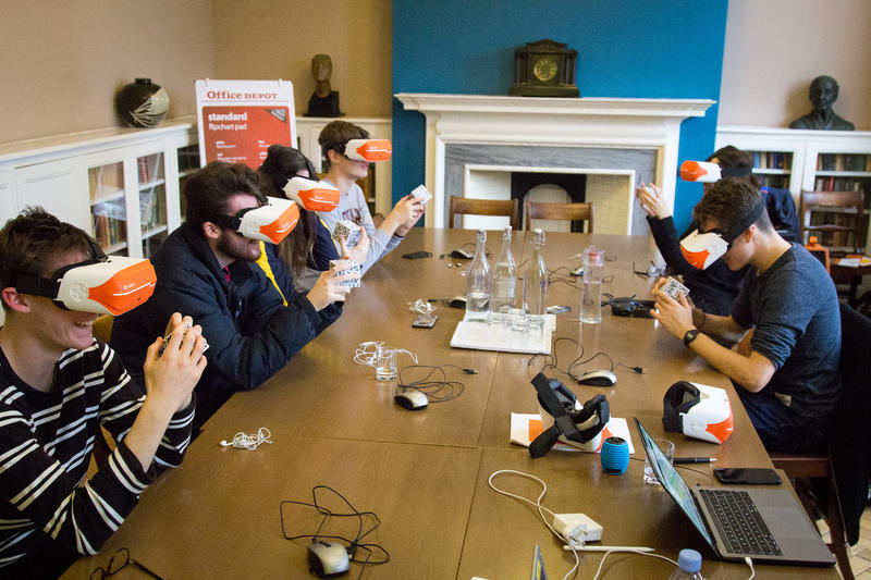 Group of Lady Margaret Hall students handling objects using Virtual Reality headsets and QR cubes. Photo by Xavier L. Lady Margaret Hall students handling objects using the ClassVR Virtual Reality headsets with QR cubes to virtually handle objects. Photo by Xavier L.